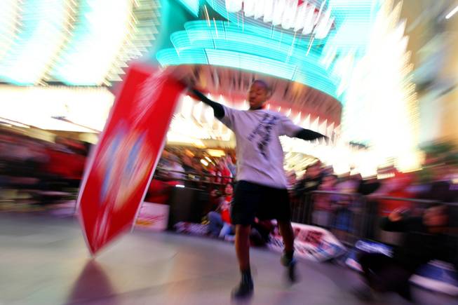 Teddy Hale competes at the AArrow Sign Spinning company's championship Saturday, Feb. 23, 2013 at the Fremont Street Experience.
